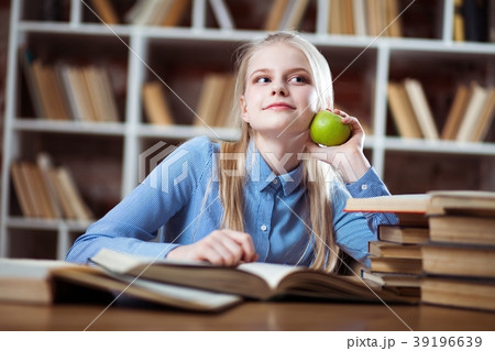 Teenage girl in a library 39196639