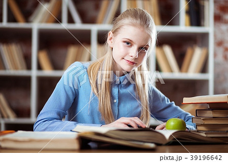 Teenage girl in a library 39196642