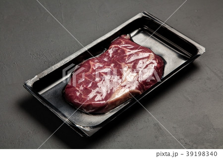 Raw steak in an airtight packaging Raw steak in an airtight packaging 39198340
