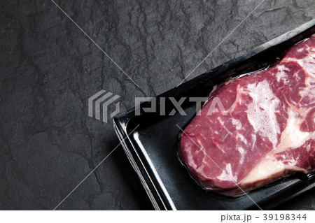 Raw steak in an airtight packaging Raw steak in an airtight packaging 39198344