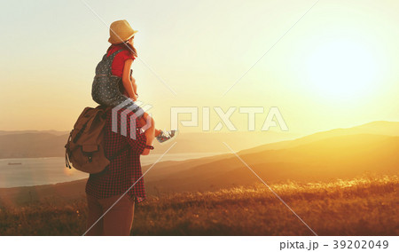 family travel and tourism father and daughter   on top of mounta 39202049