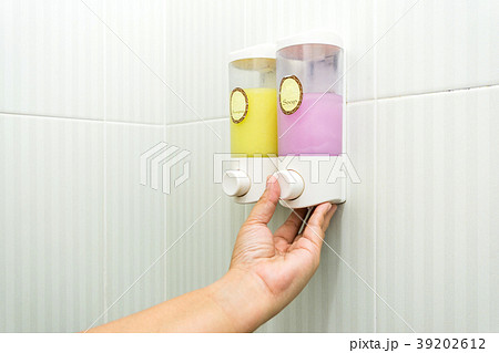 Liquid soap and shampoo dispenser in a bathroom 39202612