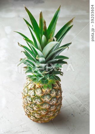 Whole pineapple fruit on grey concrete background 39203604