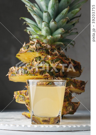 Pineapple fresh juice in glass on a wooden table Pineapple fresh juice in glass on a wooden table 39203755