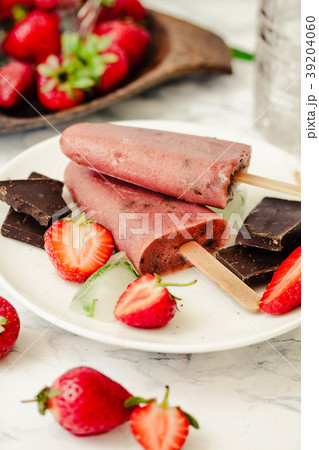Strawberry ice cream with chocolate on a stick. Strawberry ice cream with chocolate on a stick. 39204060