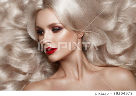 Beautiful blonde in a Hollywood manner with curls 39204978