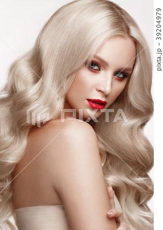 Beautiful blonde in a Hollywood manner with curls 39204979
