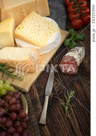 Cheeses with rosemary, tomatoes, grapes and salame Cheeses with rosemary, tomatoes, grapes and salame 39205940