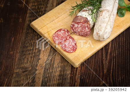 Dried salami with rosemary and basil. 39205942