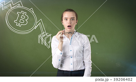 Woman standing near btc logo. Concept of virtual Woman standing near btc logo. Concept of virtual 39206402
