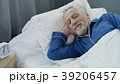 Senior man smiling while asleep in the morning Senior man smiling while asleep in the morning 39206457