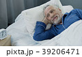 Senior male waking up and smiling after Senior male waking up and smiling after 39206471