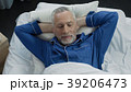 Top view of happy aged male lying in his bed and Top view of happy aged male lying in his bed and 39206473