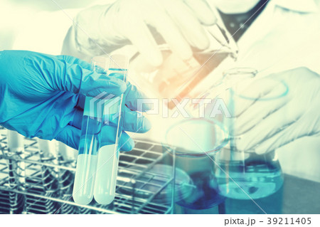 Scientist with equipment holding tools during Scientist with equipment holding tools during 39211405
