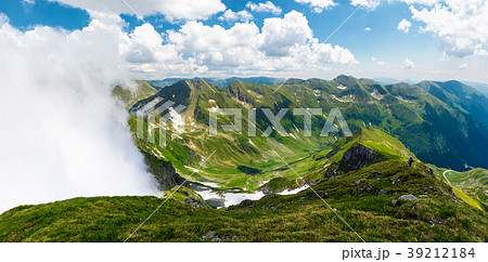 mountainous panorama with rising clouds 39212184