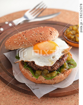 Hamburger with fried egg and gherkin salad Hamburger with fried egg and gherkin salad 39212978