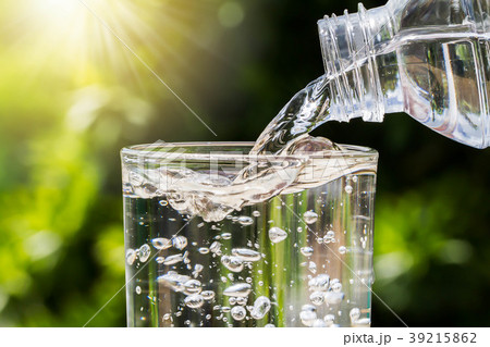 Drinking water pouring from bottle into glass  39215862