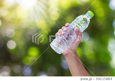 Hand holding drinking water bottle Hand holding drinking water bottle 39215864