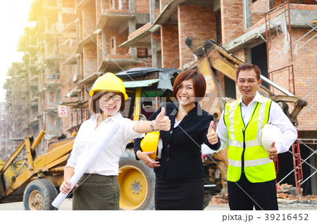 Asian project team at the construction site 39216452