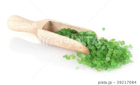 green bath salt in wooden spoon on white green bath salt in wooden spoon on white 39217084