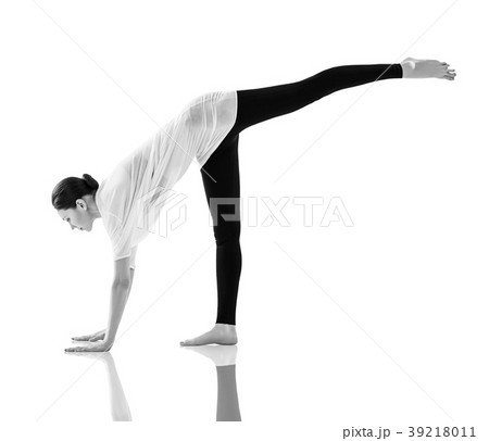 Young woman doing yoga exercise on the floor. 39218011