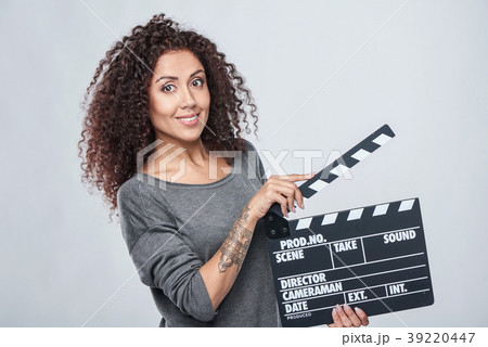 Female holding movie clapper board Female holding movie clapper board 39220447