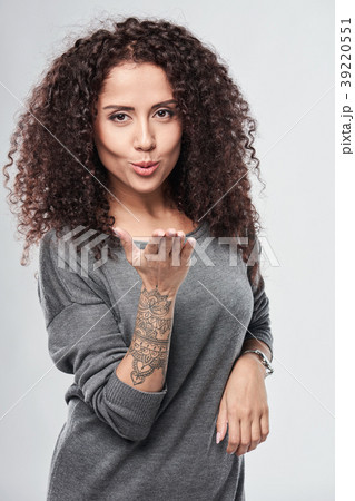 Woman blowing a kiss 39220551