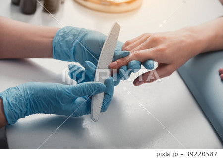 Woman arm having manicure on table 39220587