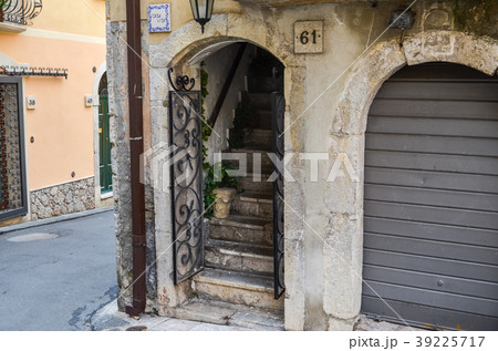 Open door with steep stairs behind it Open door with steep stairs behind it 39225717