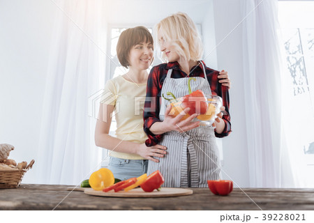 Joyful skillful woman cooking Joyful skillful woman cooking 39228021