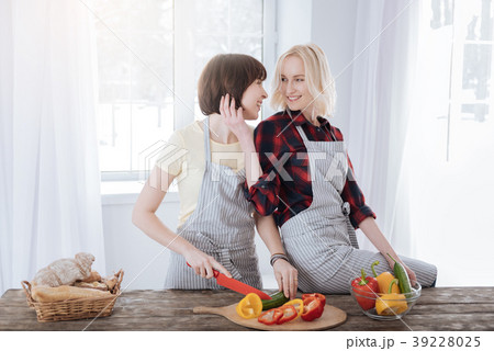 Happy cheerful women cooking Happy cheerful women cooking 39228025