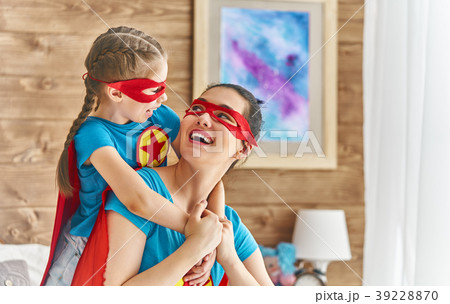 Girl and mom in Superhero costume 39228870