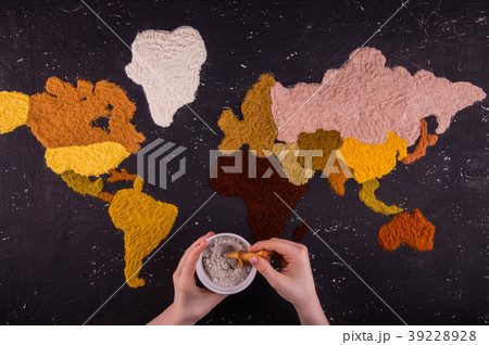 Hands with a jar of spices against the background  39228928