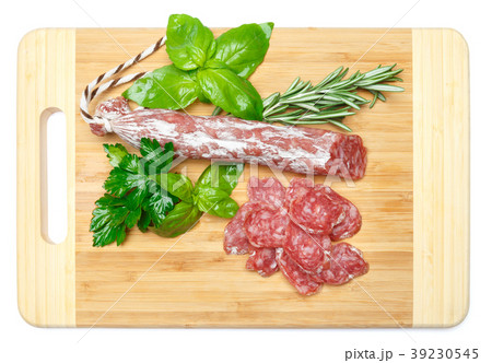 Dried sliced organic salami sausage on wooden Dried sliced organic salami sausage on wooden 39230545