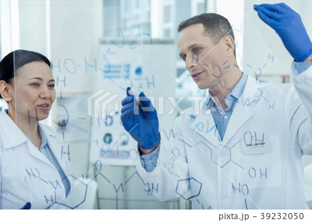 Happy scientists working on their research Happy scientists working on their research 39232050