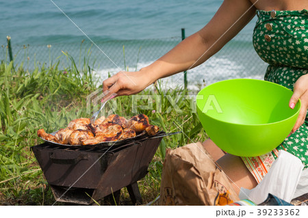 Grilled chicken thighs on the flaming grill. Grilled chicken thighs on the flaming grill. 39233362