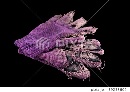 Pair of shabby mittens on black background Pair of shabby mittens on black background 39233602