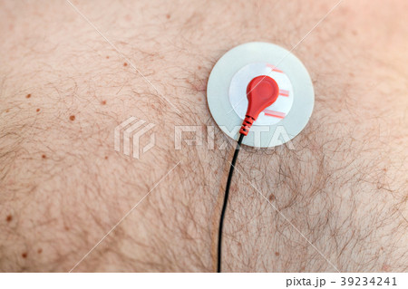 Holter monitor device sensor on human male body Holter monitor device sensor on human male body 39234241