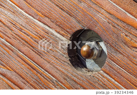 close up of old rusty screw head on rustic wooden close up of old rusty screw head on rustic wooden 39234346