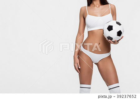 Sexy brunette with a soccer ball Sexy brunette with a soccer ball 39237652