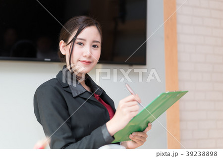 Business woman holding Folder tablet 39238898