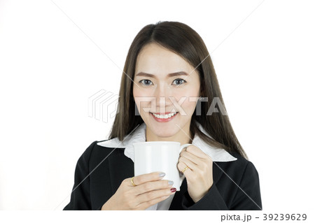 Attractive asian businesswoman drinking coffee. Attractive asian businesswoman drinking coffee. 39239629