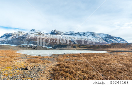 Mountains, valleys and volcano near ice cave 39242163