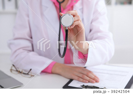 Doctor with a stethoscope in the hands 39242504