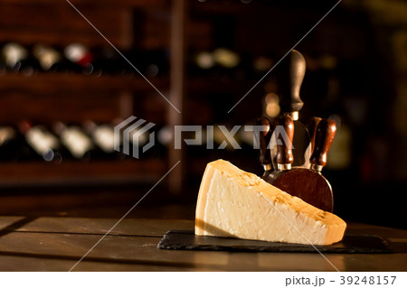 Cheese and accessories placed on a wooden table in Cheese and accessories placed on a wooden table in 39248157