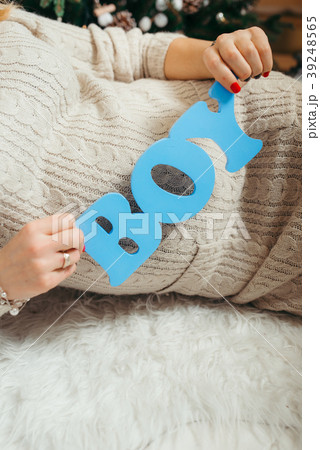 Blue wooden sign ''boy'' in the hands of the Blue wooden sign ''boy'' in the hands of the 39248565