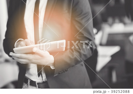 Midsection of businessman using digital tablet in Midsection of businessman using digital tablet in 39252088