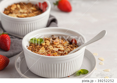 Homemade summer breakfast strawberry crumble.  39252252