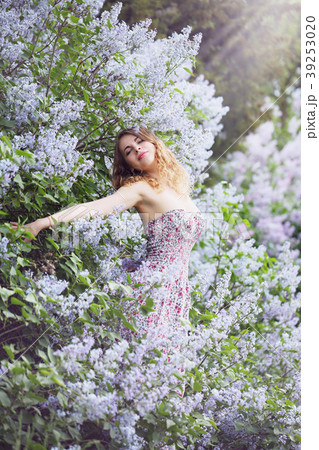 woman hugging lilac bush 39253020