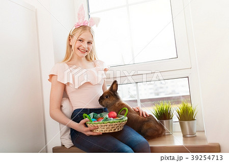 Teenage girl holding Easter eggs Teenage girl holding Easter eggs 39254713